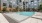 a swimming pool in a courtyard between buildings
