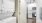 a kitchen with white cabinets and a washer and dryer