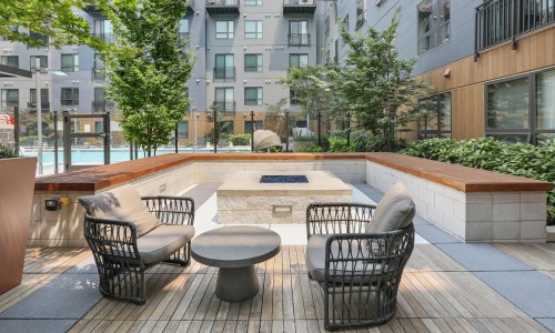 a patio with chairs and tables