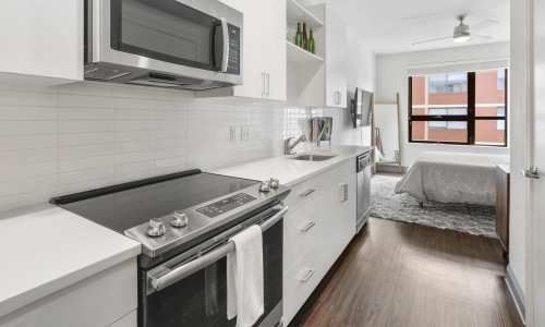 a kitchen with white cabinets